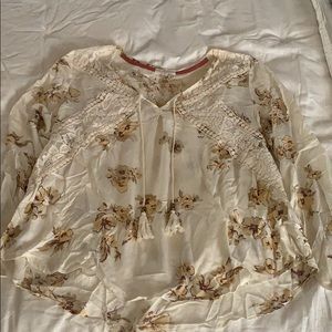 Pretty sheer and lace top from The Buckle